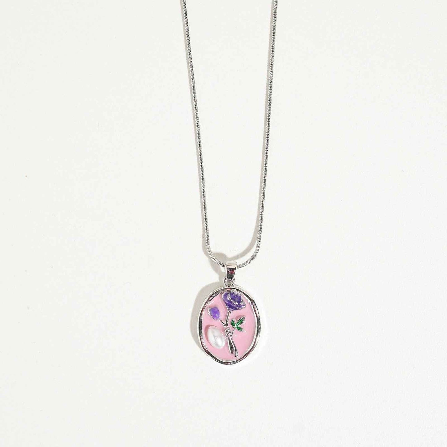 Silver-tone pendant necklace for women with pink and lavender floral design, elegant fashion accessory for special occasions and gifting.