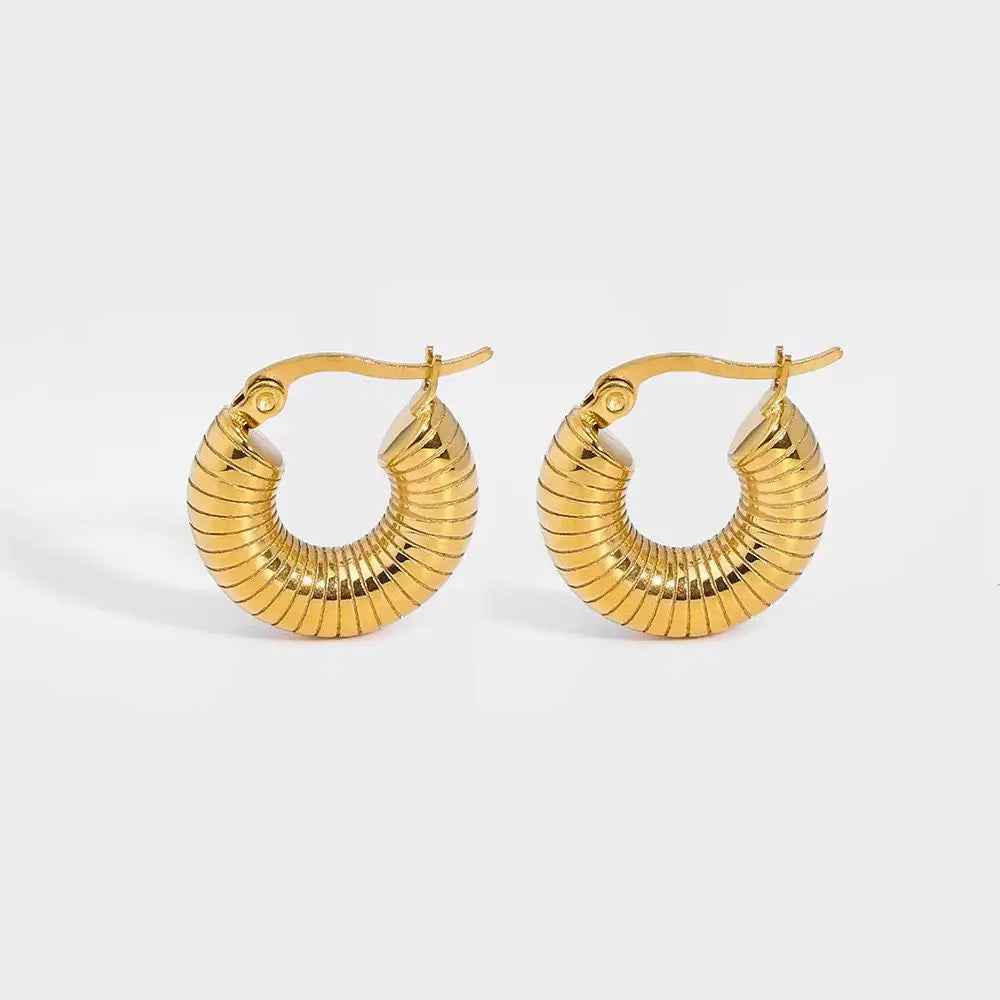 Gold earrings with warm gold-tone fashion jewellery polish