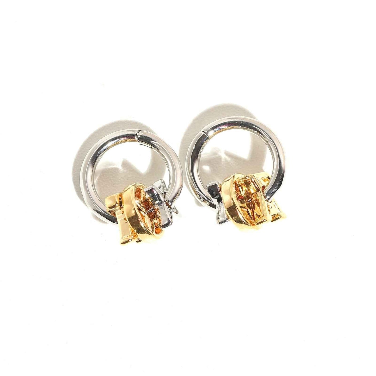 Magnus ear hoops collection with smooth curved silhouettes