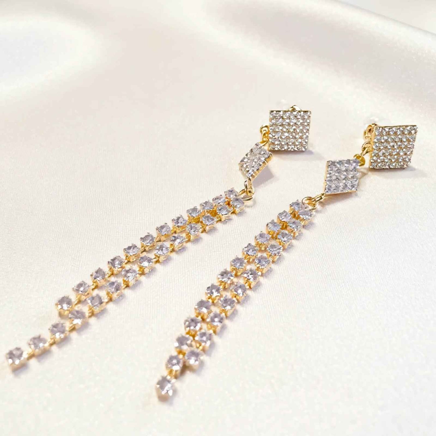 Dangly earrings styled with Pakistani kurta and tied hair