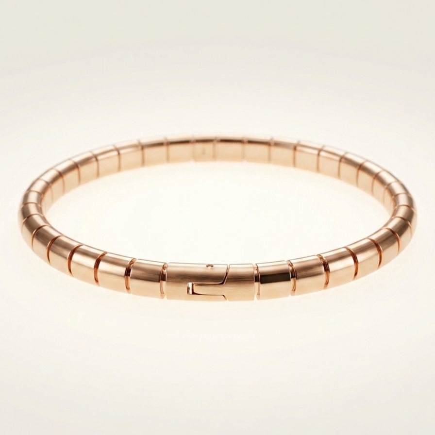Rose gold bracelet on a light beige background