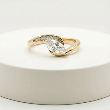elegant statement ring for women with marquise center stone and pavé split-shank design