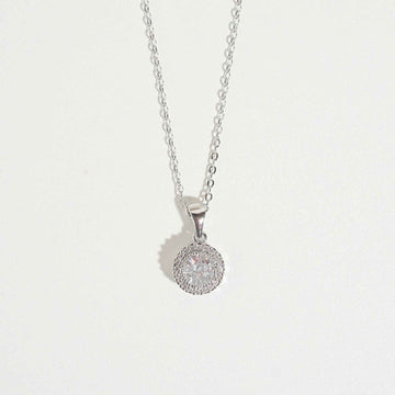 White Queen Necklace by Magnus, women’s pendant necklace with round halo-style white stone look, silver-tone chain, zircon necklace style in Pakistan
