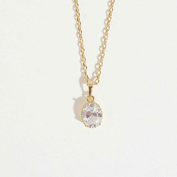 Oval Cut Necklace by Magnus, women’s pendant necklace with oval clear stone look, gold-tone chain, elegant zircon necklace style in Pakistan