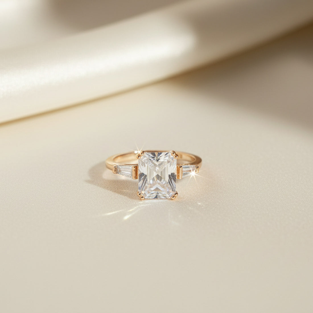 accent fashion ring for women, bold fashion ring for women, statement accent ring for women, trendy focal ring for women, eye-catching fashion ring, standout accent style ring, decorative statement ring, chic women's fashion accessory, modern focal detail ring, emerald-cut three-stone yellow gold-tone ring
